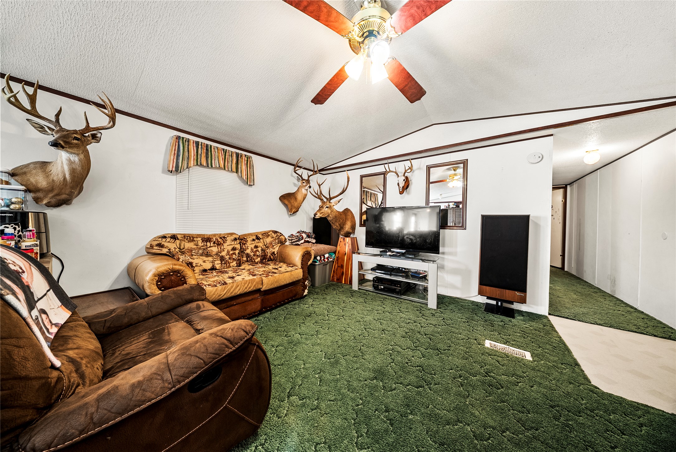 5101 County Road 463 Elgin, TX 78621 - Photo 35 of 38 a bedroom with furniture and a flat screen tv