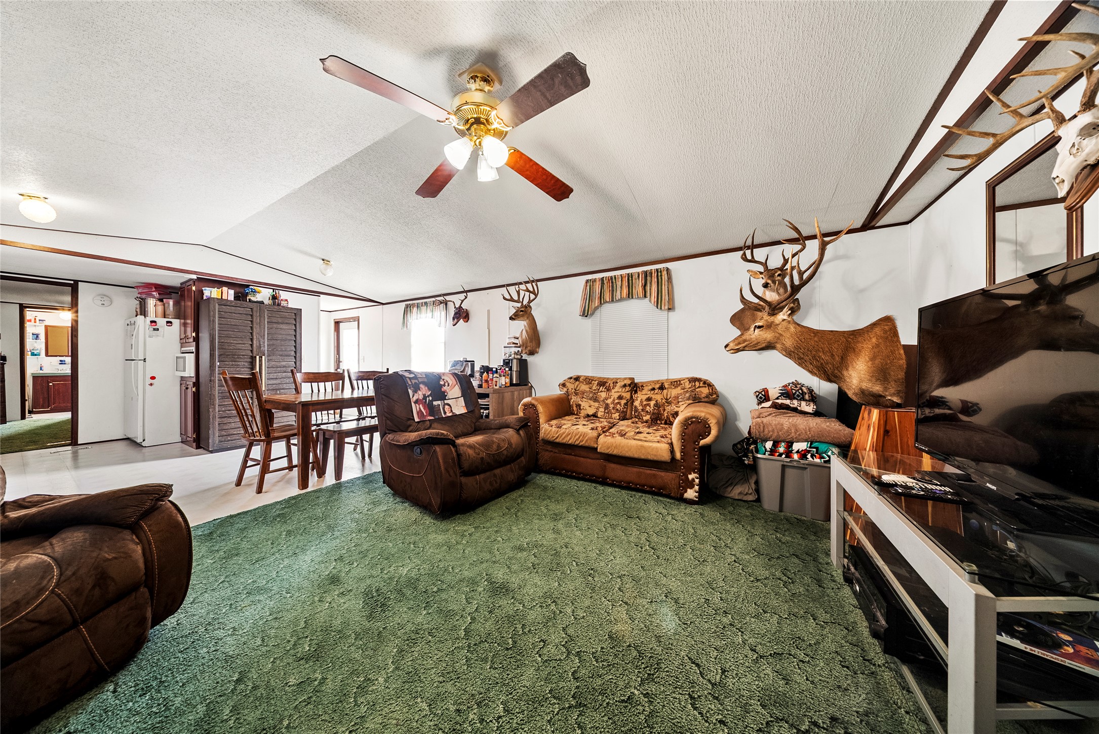 5101 County Road 463 Elgin, TX 78621 - Photo 36 of 38 a living room with furniture and a flat screen tv
