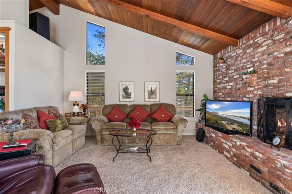 498 Croyden Lane Cambria, CA 93428 - Photo 20 of 68 a living room with furniture and a flat screen tv
