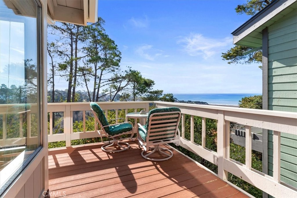 498 Croyden Lane Cambria, CA 93428 - Photo 26 of 68 a view of a balcony with chairs and wooden floor