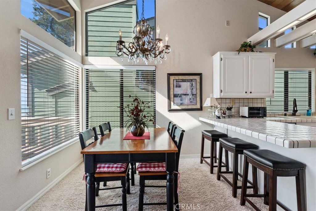 498 Croyden Lane Cambria, CA 93428 - Photo 29 of 68 a view of a dining room with furniture and window