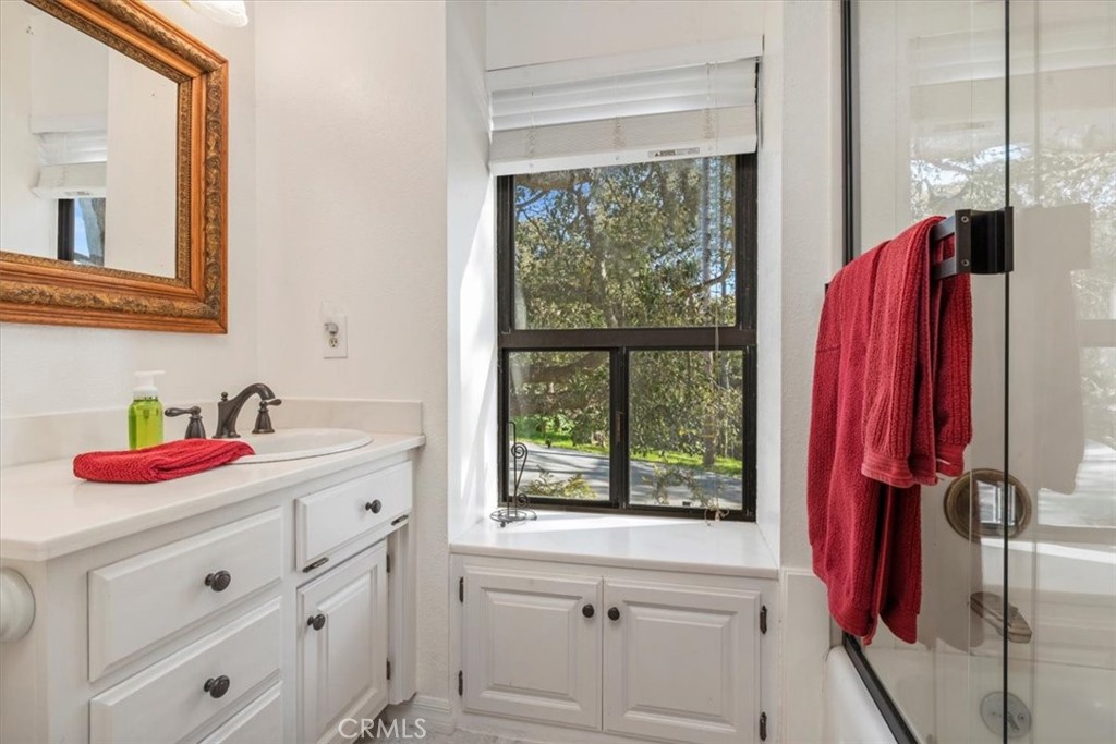 498 Croyden Lane Cambria, CA 93428 - Photo 38 of 68 a bathroom with a sink and a window