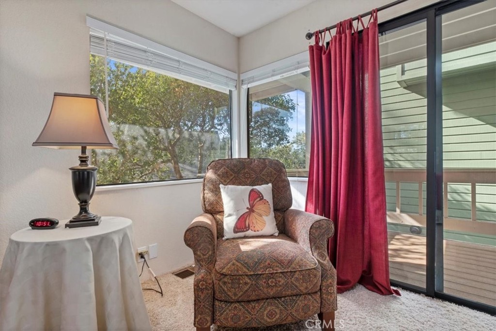 498 Croyden Lane Cambria, CA 93428 - Photo 44 of 68 a living room with furniture and a floor to ceiling window