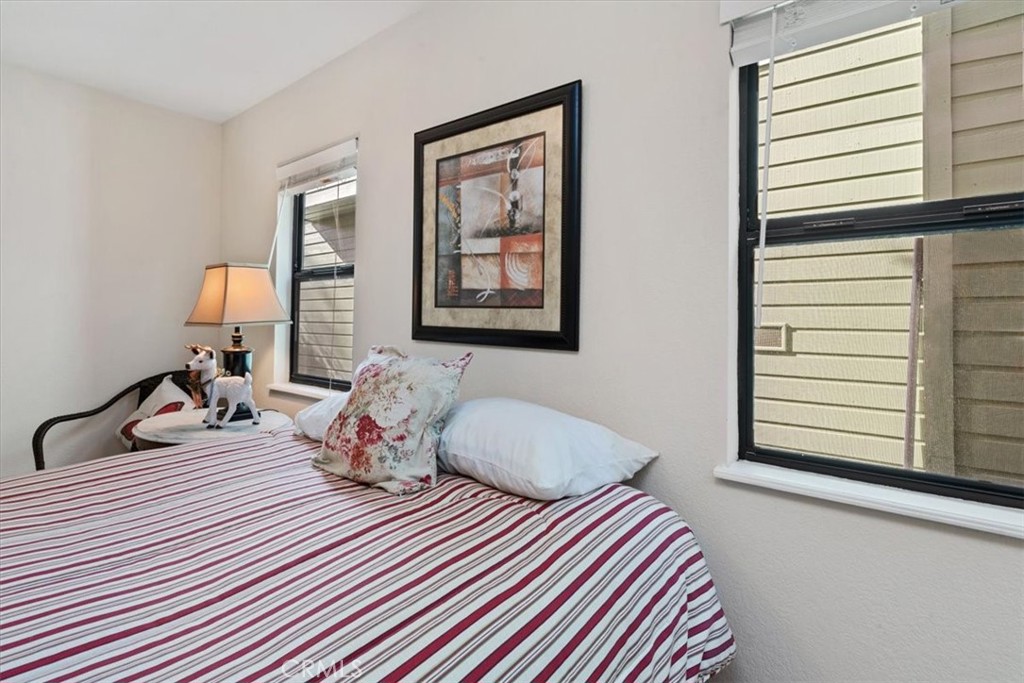 498 Croyden Lane Cambria, CA 93428 - Photo 49 of 68 a bedroom with two beds and a window
