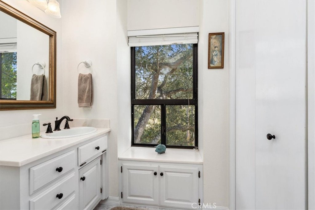 498 Croyden Lane Cambria, CA 93428 - Photo 55 of 68 a bathroom with a sink and a mirror