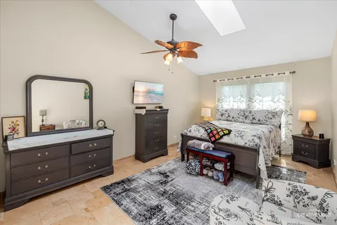 a living room with furniture and a mirror