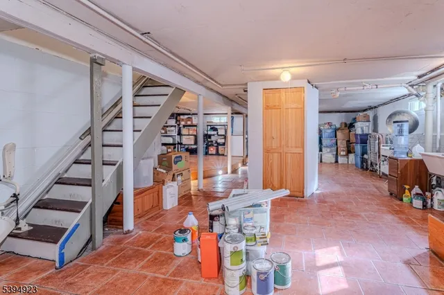 a living room with lots of furniture and wooden floor