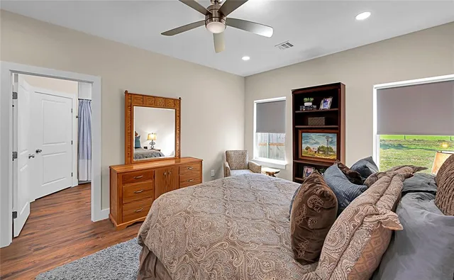 a bed room with a bed and a television