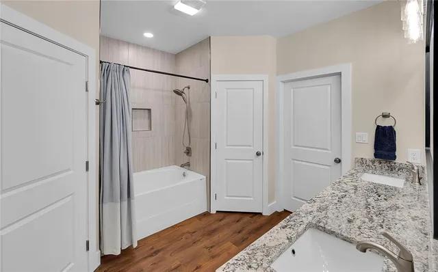 a bathroom with a bathtub and a shower
