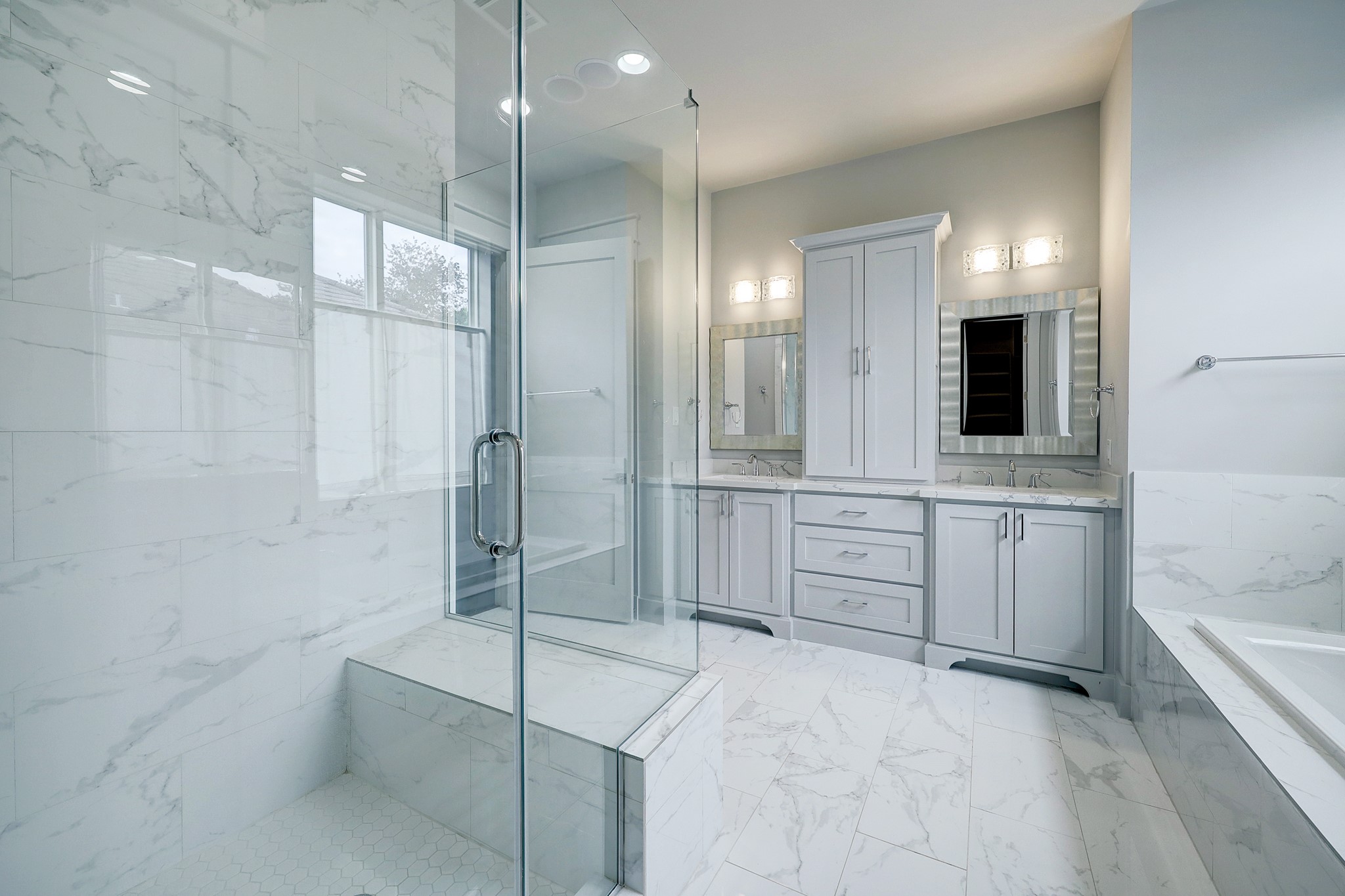 609 West Pierce Street Houston, TX 77019 - Photo 15 of 32 a bathroom with a double vanity sink a toilet a mirror and shower