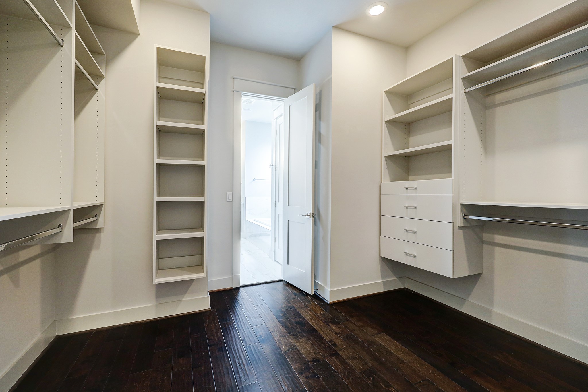 609 West Pierce Street Houston, TX 77019 - Photo 16 of 32 a view of walk in closet with empty racks