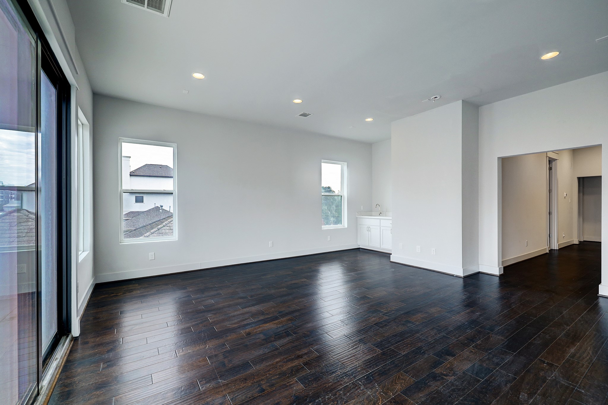 609 West Pierce Street Houston, TX 77019 - Photo 23 of 32 a view of an empty room with wooden floor and a window