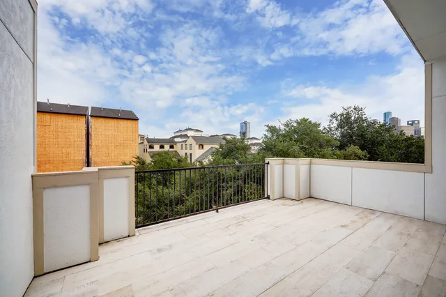 a view of balcony with yard