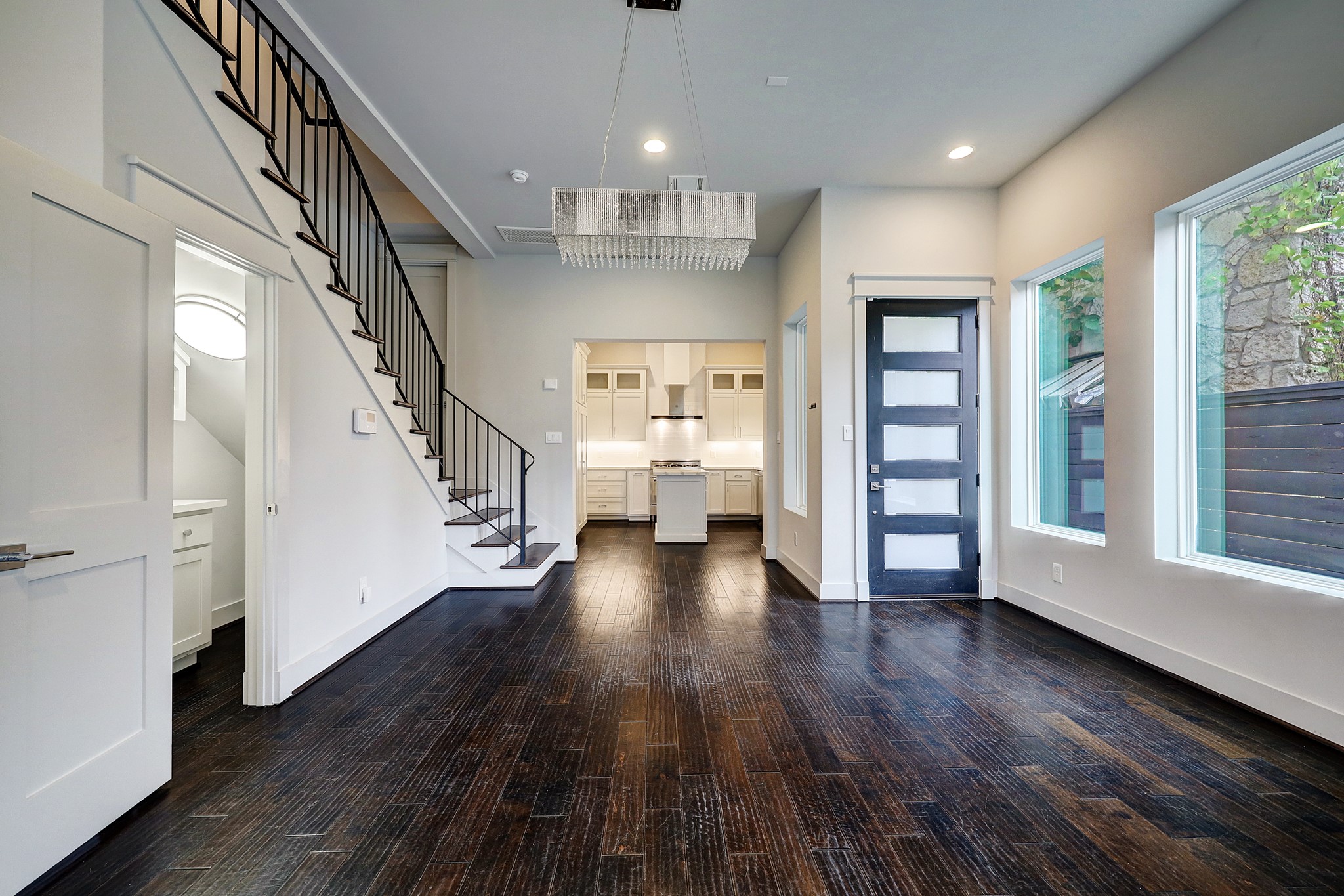 609 West Pierce Street Houston, TX 77019 - Photo 3 of 32 wooden floor in an empty room with a wooden floor and windows