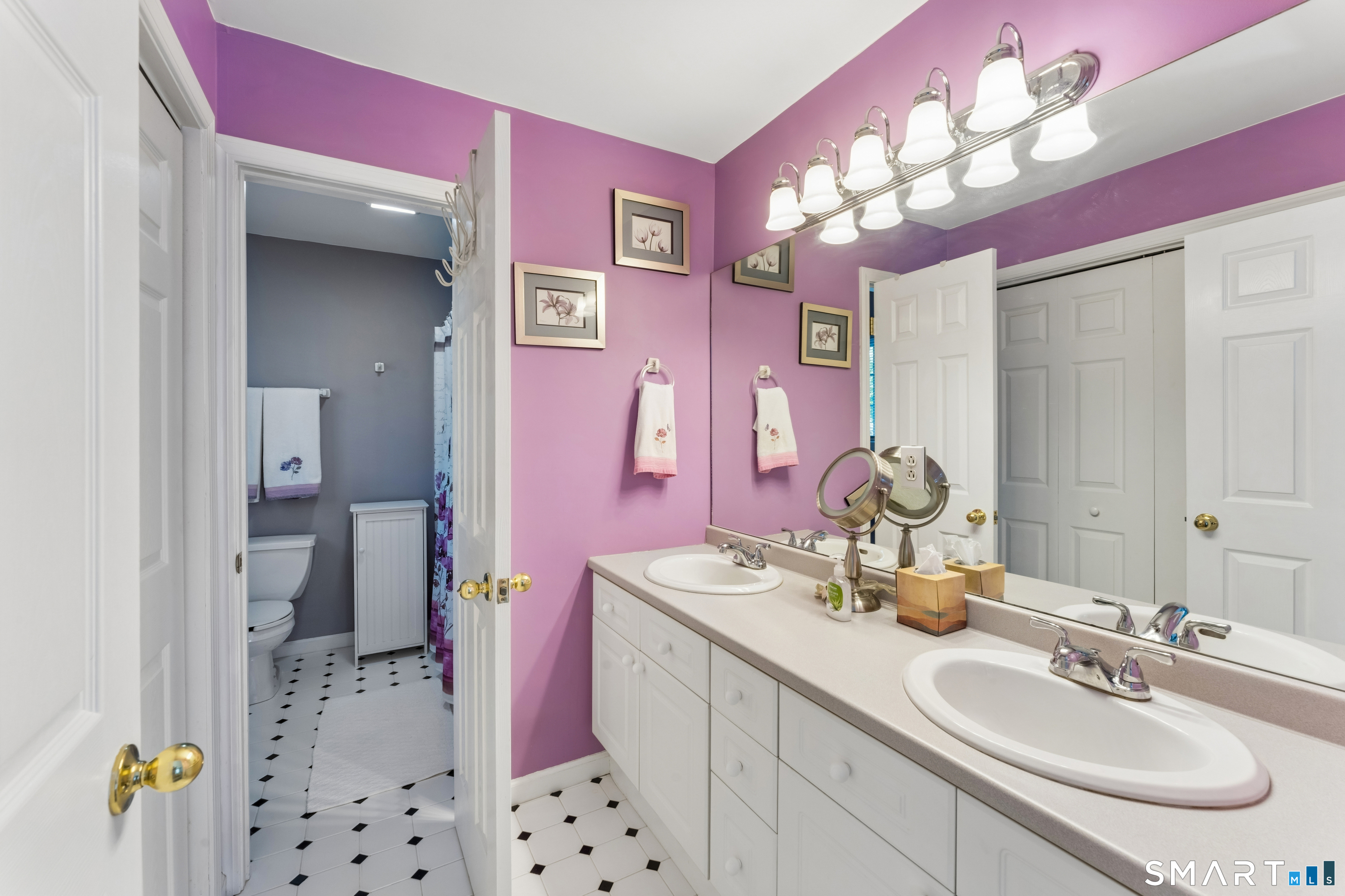 10 Ferris Road Newtown, CT 06470 - Photo 26 of 40 a bathroom with a sink vanity and a mirror