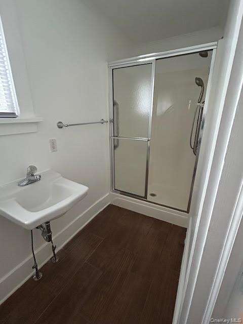 198 Knickerbocker Avenue Rochester, NY 14615 - Photo 11 of 13 a bathroom with a sink a mirror and a shower