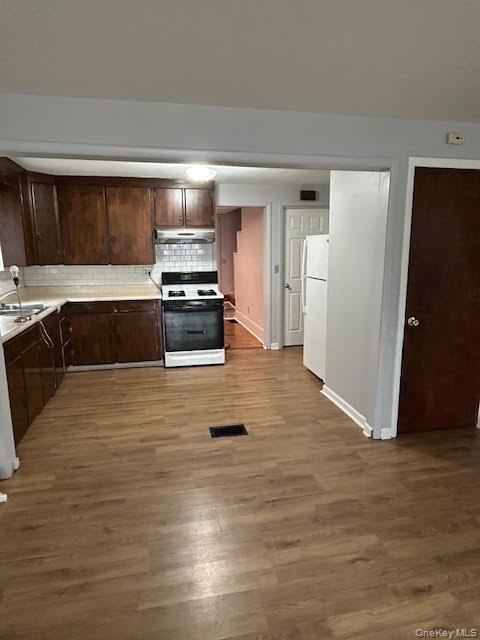 198 Knickerbocker Avenue Rochester, NY 14615 - Photo 3 of 13 a kitchen with granite countertop a stove and cabinets