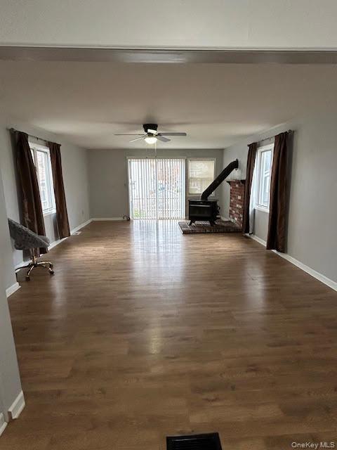 198 Knickerbocker Avenue Rochester, NY 14615 - Photo 4 of 13 a view of a room with wooden floor and a window