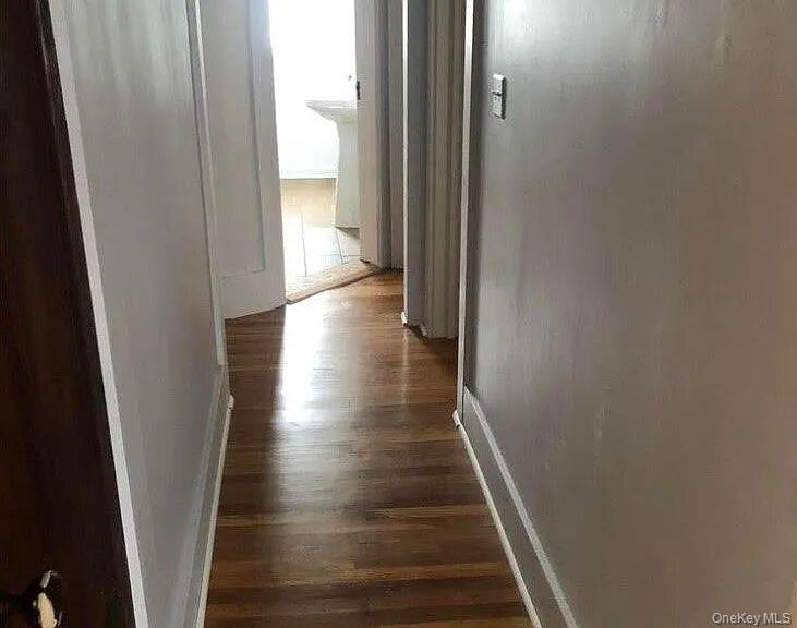 198 Knickerbocker Avenue Rochester, NY 14615 - Photo 6 of 13 a view of a hallway with wooden floor