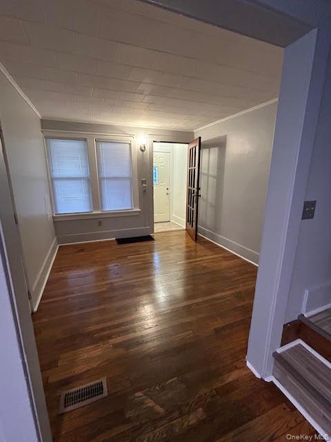 198 Knickerbocker Avenue Rochester, NY 14615 - Photo 10 of 13 a view of an empty room with wooden floor and a window