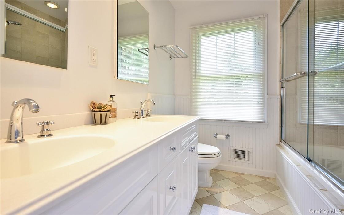 9 Franklin Avenue Rye, NY 10580 - Photo 22 of 35 a bathroom with a double vanity sink toilet and shower