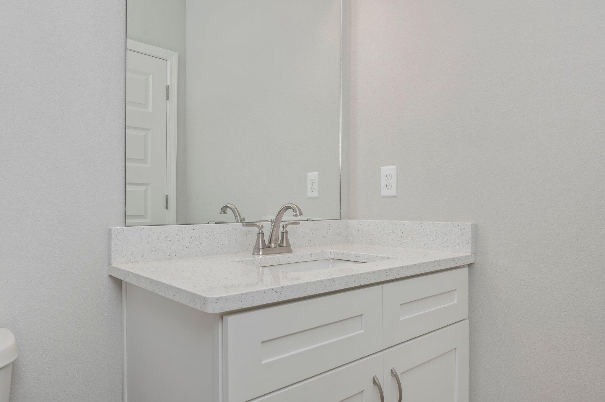 95 Live Oak Street Freeport, FL 32439 - Photo 18 of 26 a bathroom with a sink and a mirror