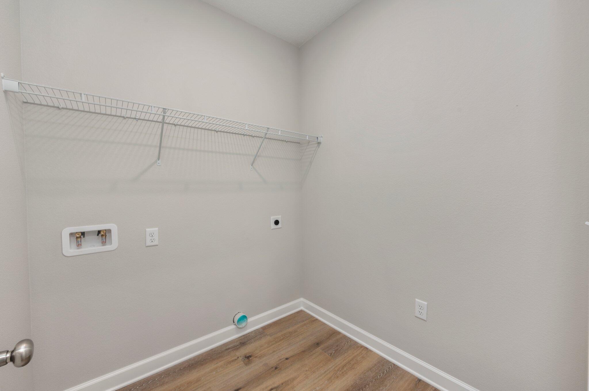 95 Live Oak Street Freeport, FL 32439 - Photo 25 of 26 a view of a room with empty racks on the wall