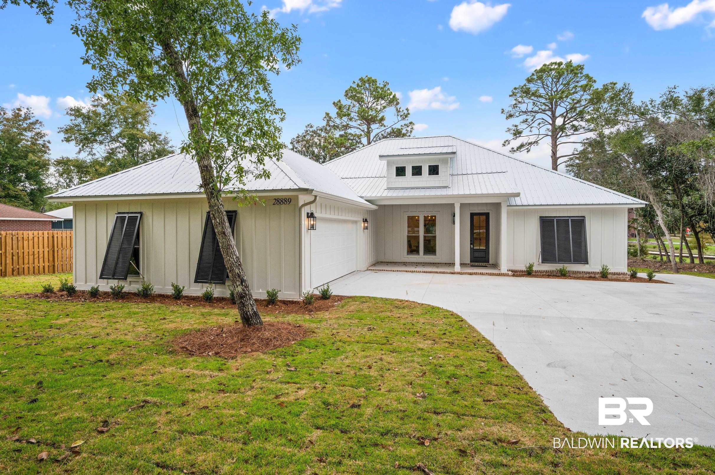 28889 Canal Road Orange Beach, AL 36561 - Photo 2 of 55 Modern farmhouse with a garage and a front lawn