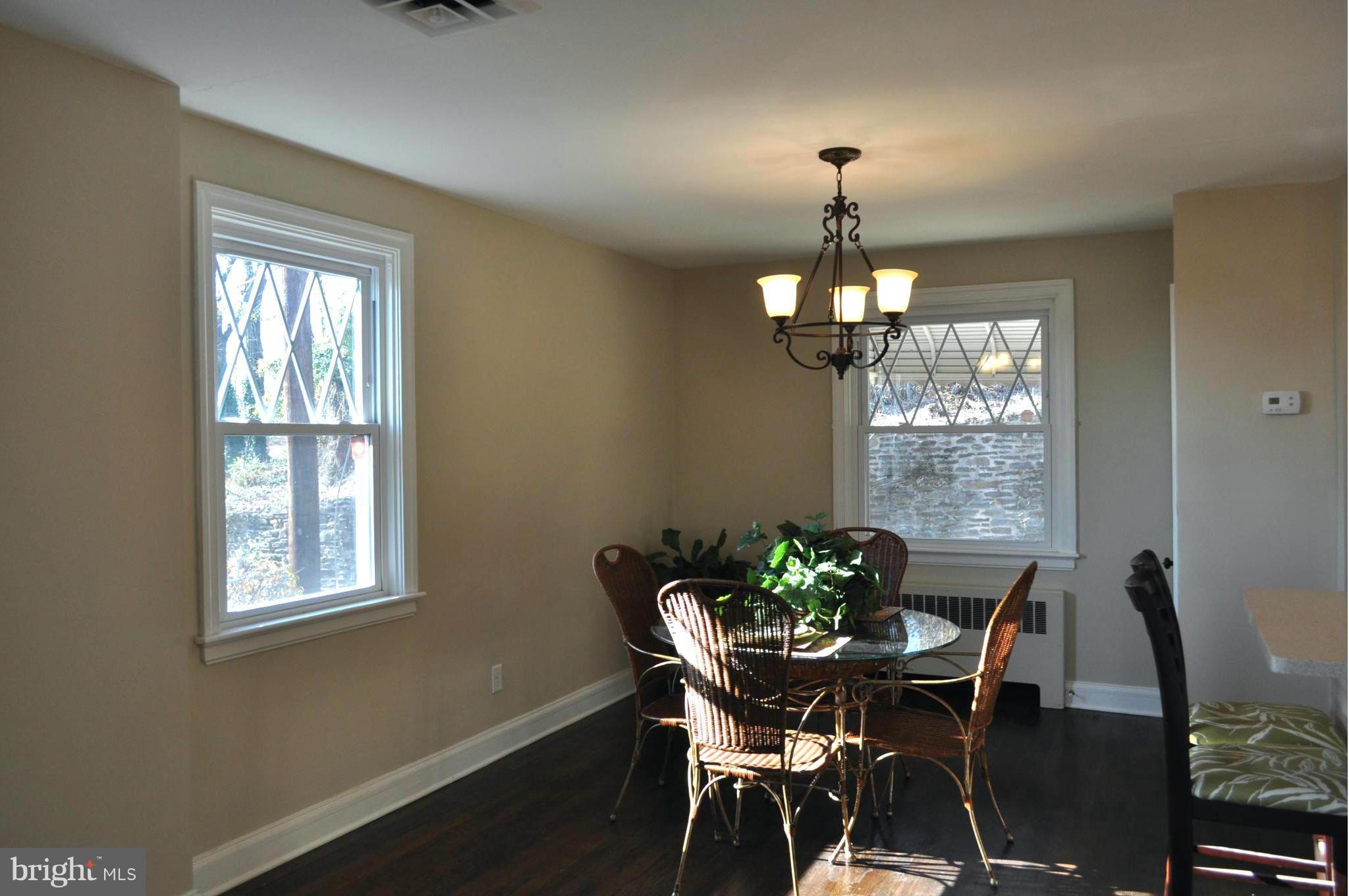 3900 Rexmere Road Baltimore, MD 21218 - Photo 13 of 23 a dining room with furniture a chandelier and window