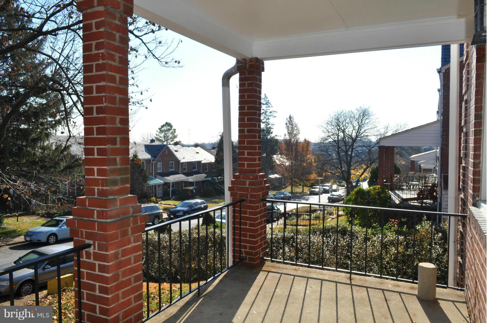 3900 Rexmere Road Baltimore, MD 21218 - Photo 23 of 23 a view of a balcony with wooden floor