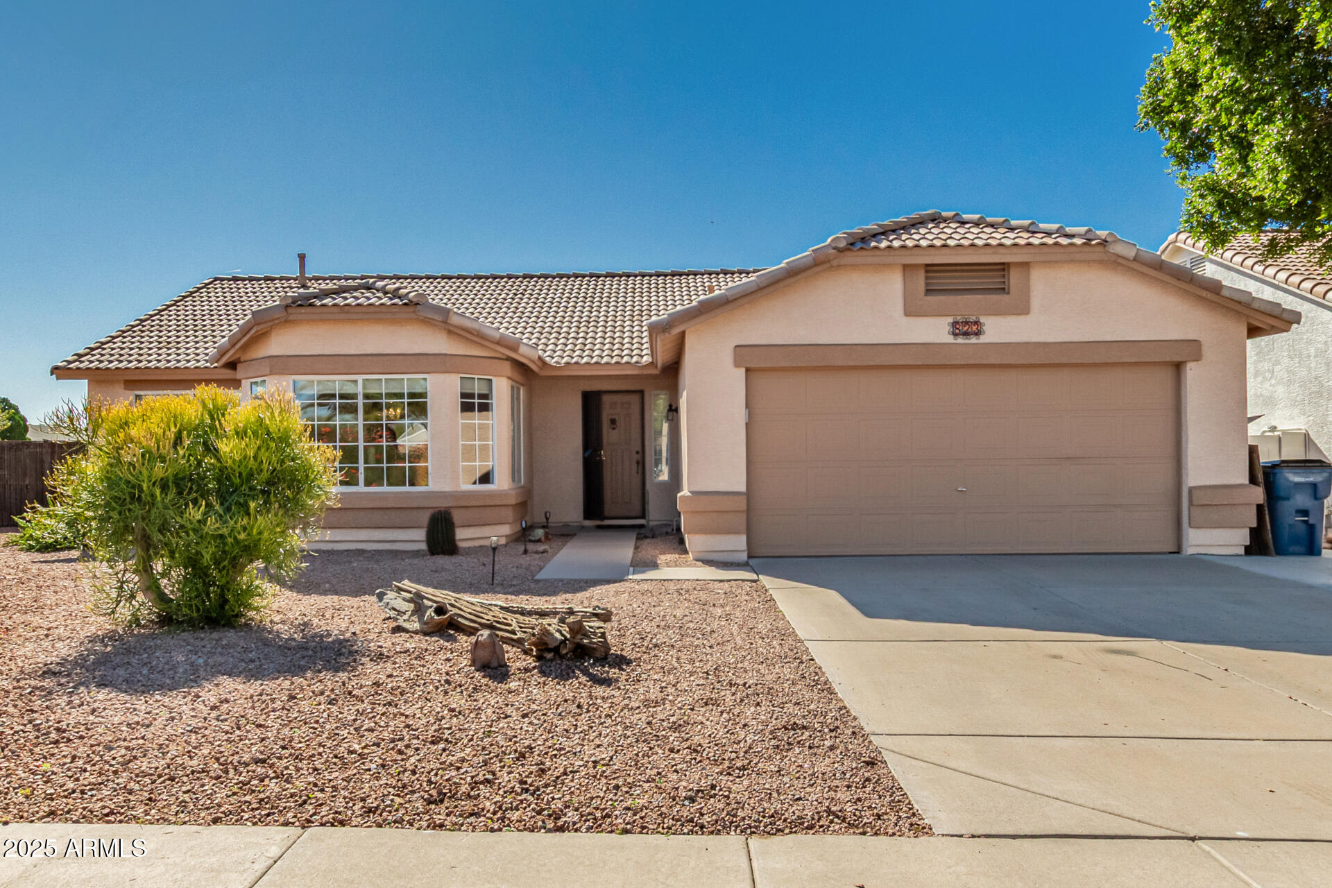 823 West 14th Avenue Apache Junction, AZ 85120 - Photo 1 of 32 a front view of a house with garden