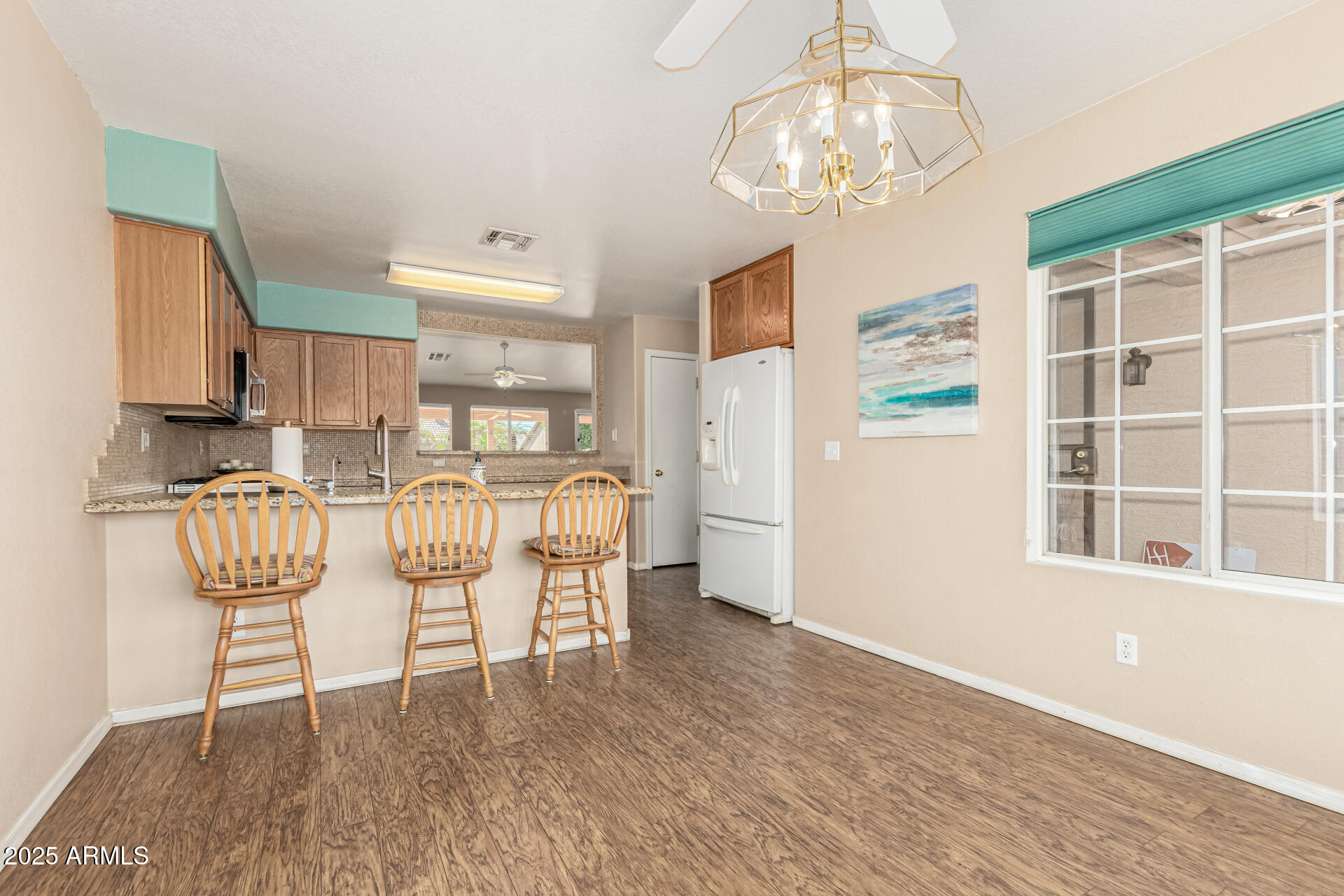 823 West 14th Avenue Apache Junction, AZ 85120 - Photo 11 of 32 a view of a dining room with furniture and chandelier