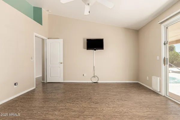 a view of room with window and hardwood floor