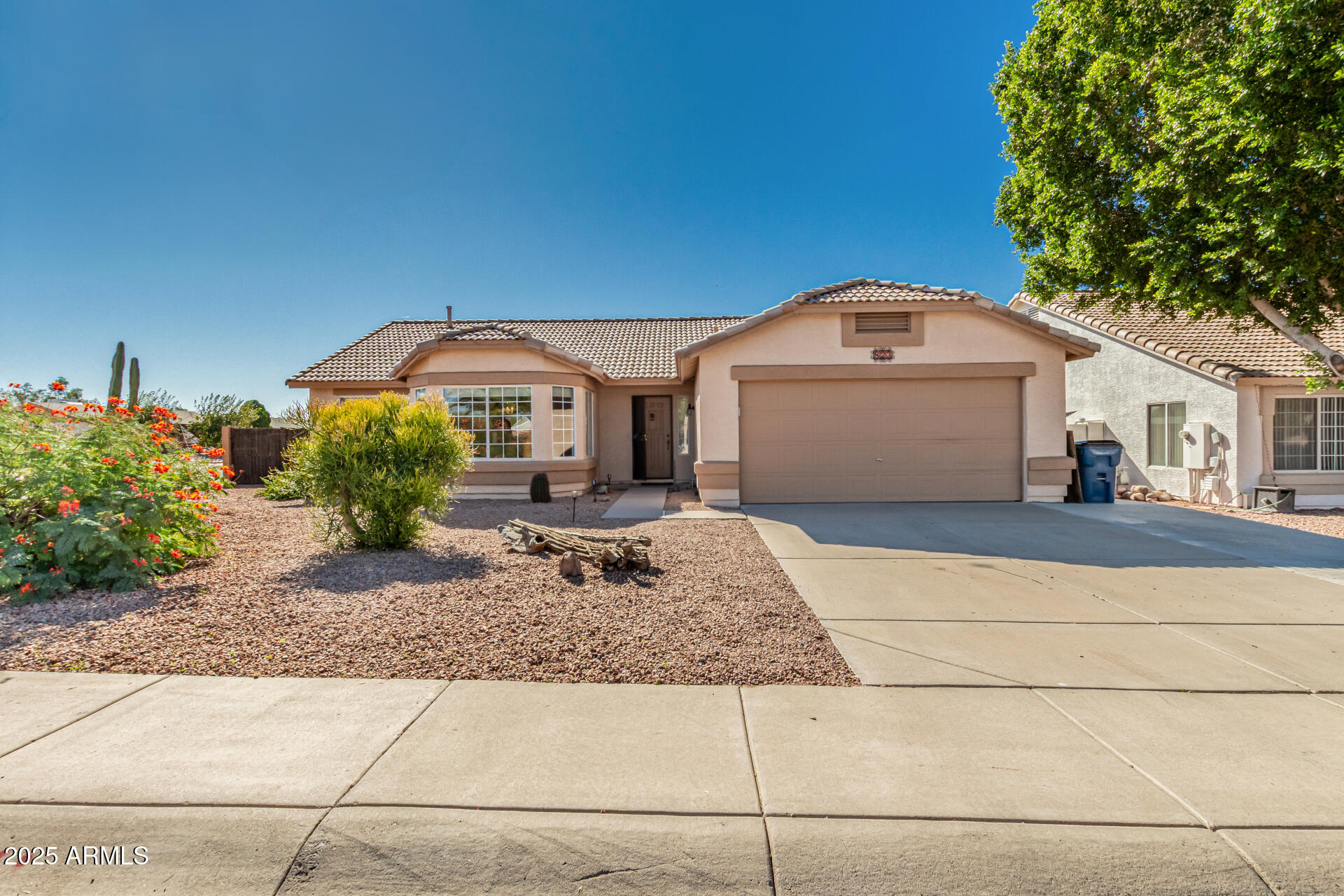 823 West 14th Avenue Apache Junction, AZ 85120 - Photo 2 of 32 a front view of a house with garden