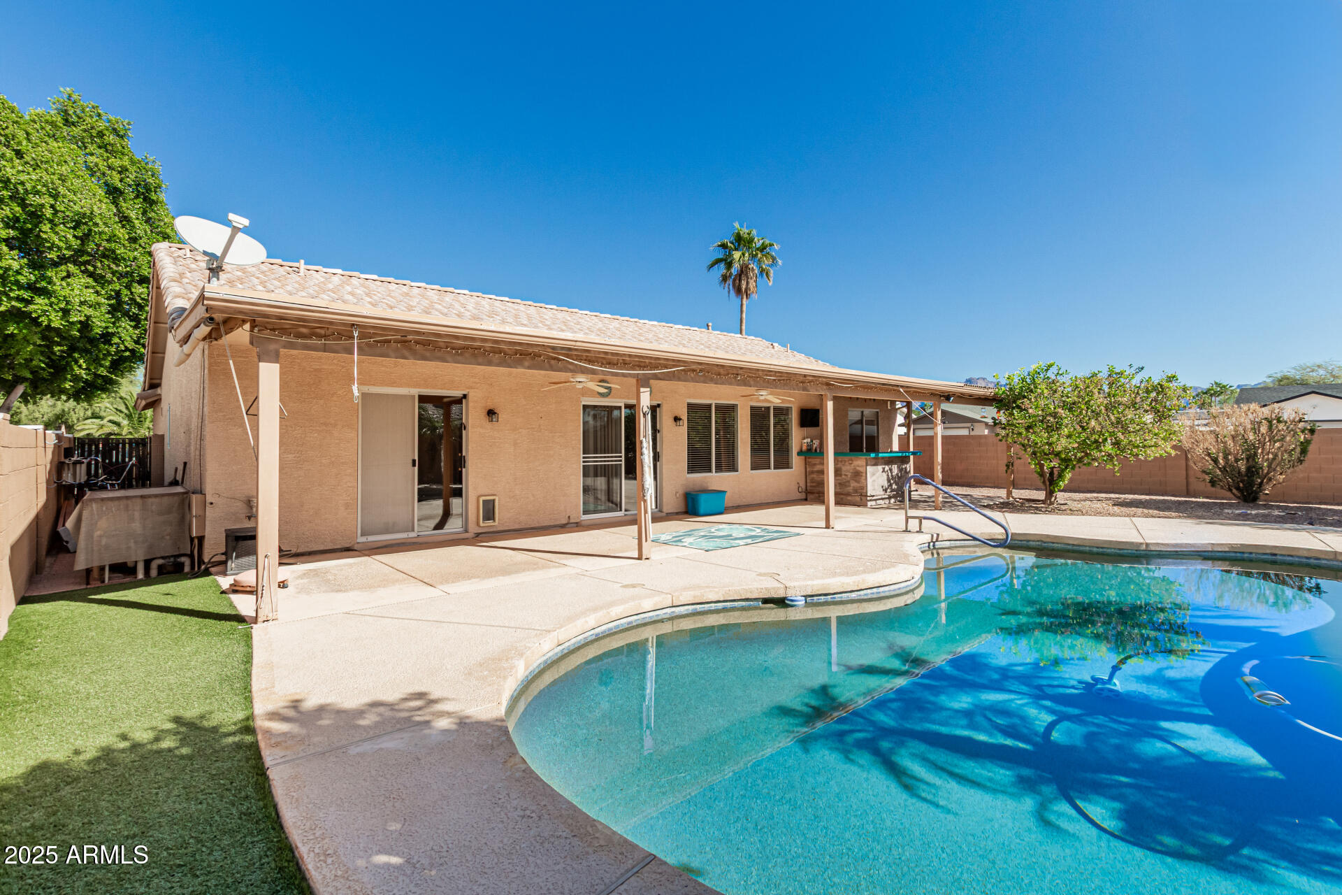 823 West 14th Avenue Apache Junction, AZ 85120 - Photo 31 of 32 a view of a house with backyard porch and sitting area