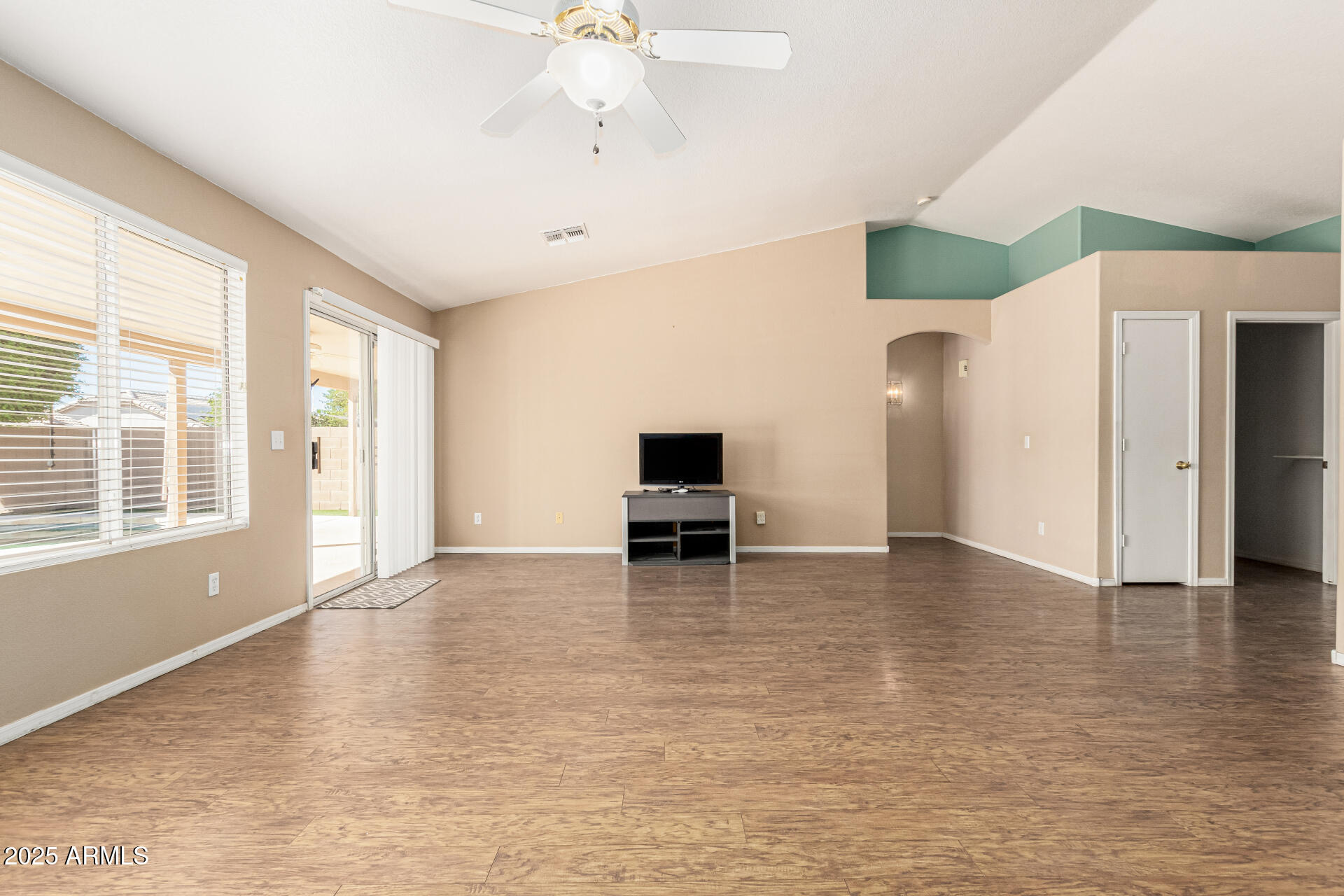 823 West 14th Avenue Apache Junction, AZ 85120 - Photo 9 of 32 a living room with furniture and a flat screen tv