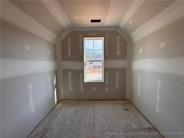 a view of an empty room and window