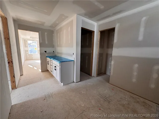a kitchen with stainless steel appliances granite countertop a refrigerator and a stove
