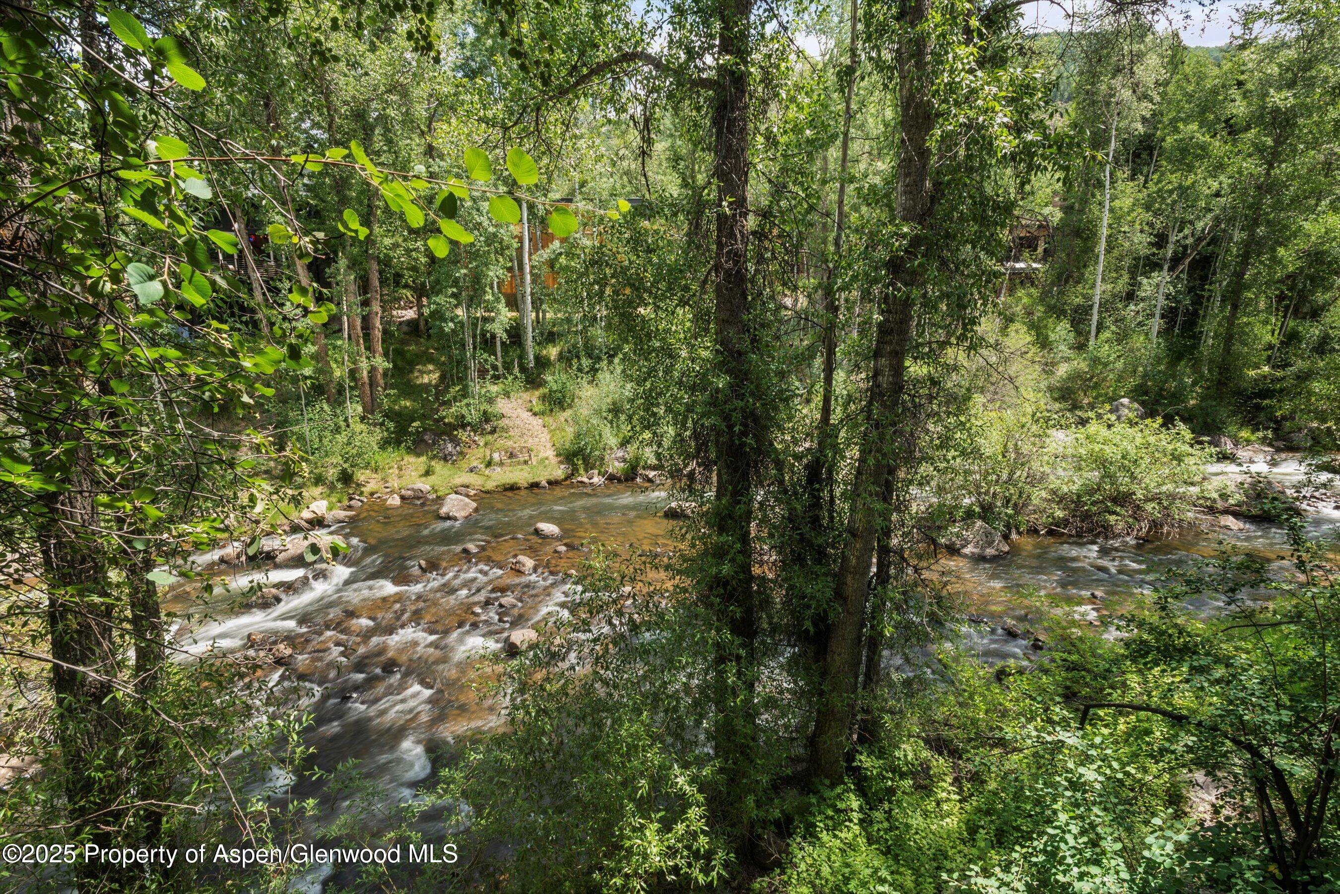 1024 East Hopkins Avenue, Unit 16 Aspen, CO 81611 - Photo 13 of 20 River off the deck