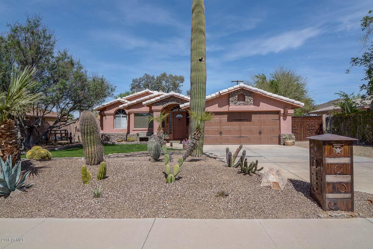840 East Roberts Road Phoenix, AZ 85022 - Photo 1 of 52 a front view of a house with a yard