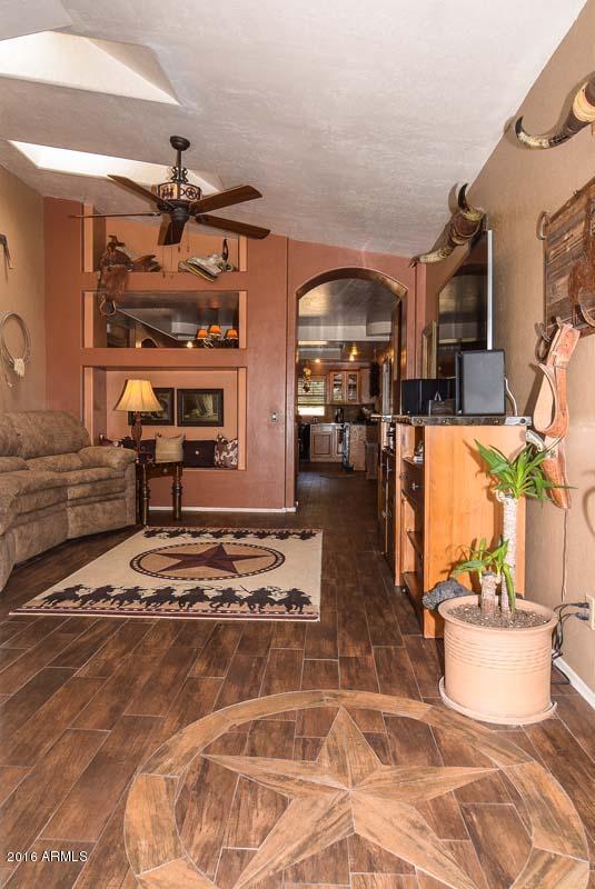 840 East Roberts Road Phoenix, AZ 85022 - Photo 15 of 52 a living room with furniture and a flat screen tv