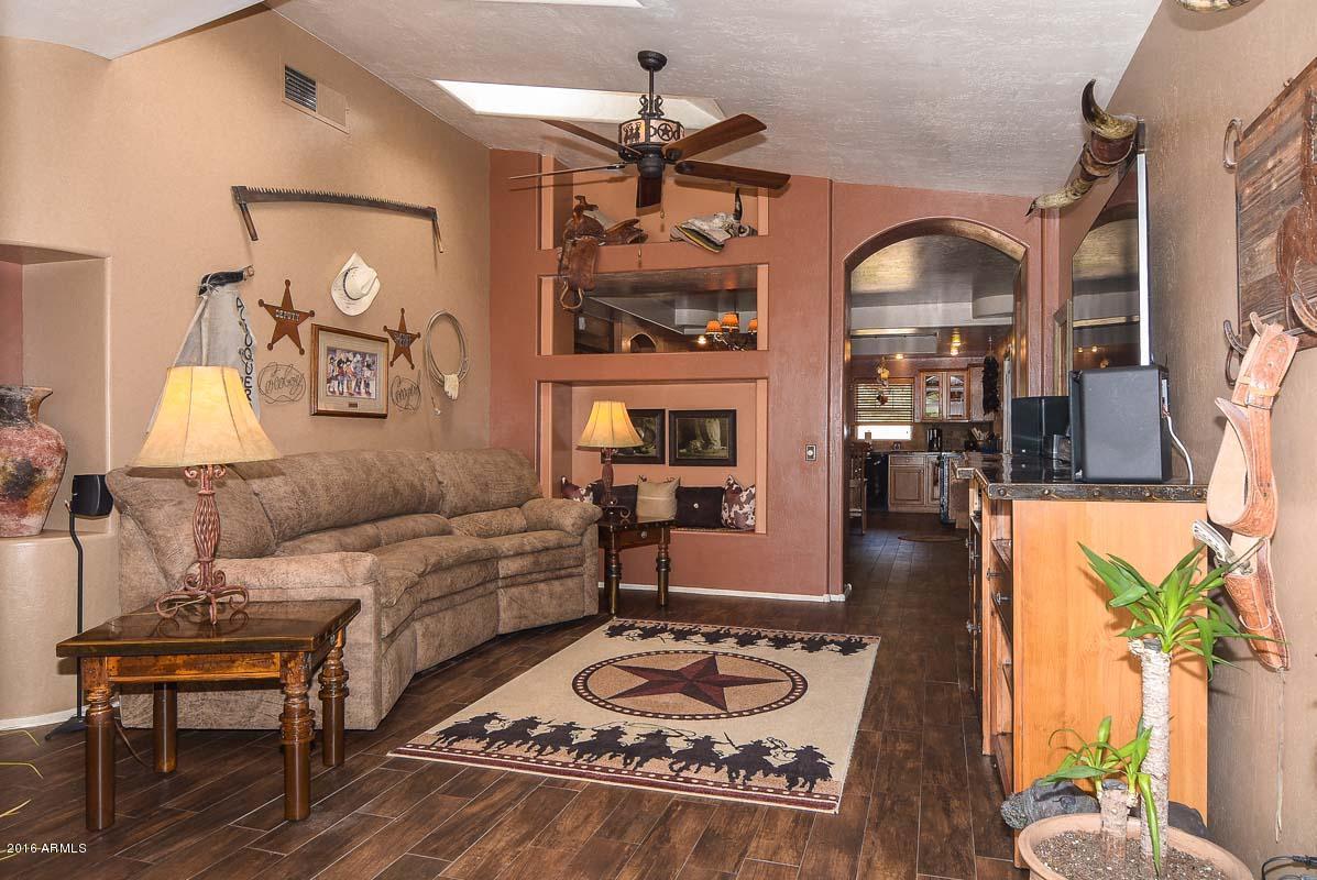 840 East Roberts Road Phoenix, AZ 85022 - Photo 16 of 52 a living room with furniture and wooden floor