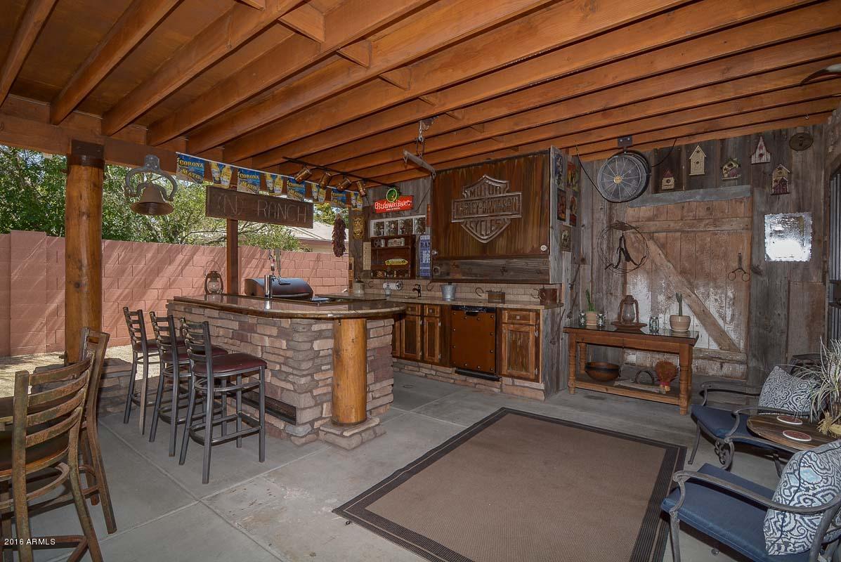 840 East Roberts Road Phoenix, AZ 85022 - Photo 3 of 52 a view of a patio with table and chairs