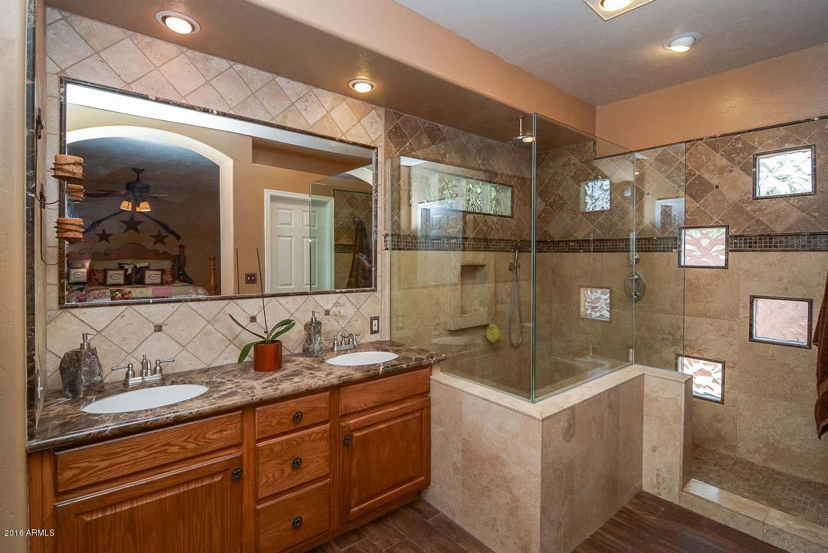 840 East Roberts Road Phoenix, AZ 85022 - Photo 31 of 52 a bathroom with a sink and a mirror