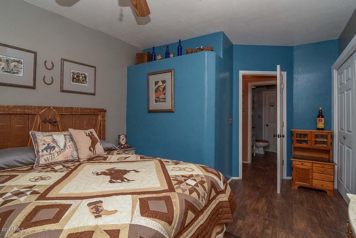 840 East Roberts Road Phoenix, AZ 85022 - Photo 36 of 52 a bedroom with a bed and a dresser