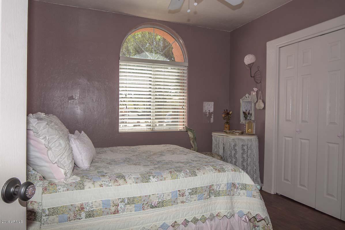 840 East Roberts Road Phoenix, AZ 85022 - Photo 38 of 52 a bedroom with a bed and a window
