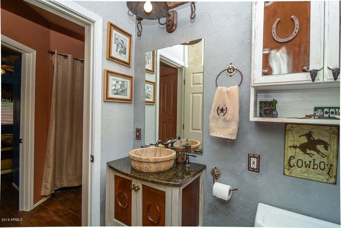 840 East Roberts Road Phoenix, AZ 85022 - Photo 40 of 52 a bathroom with a sink and a mirror