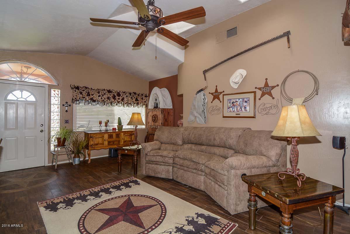 840 East Roberts Road Phoenix, AZ 85022 - Photo 4 of 52 a living room with furniture and a table