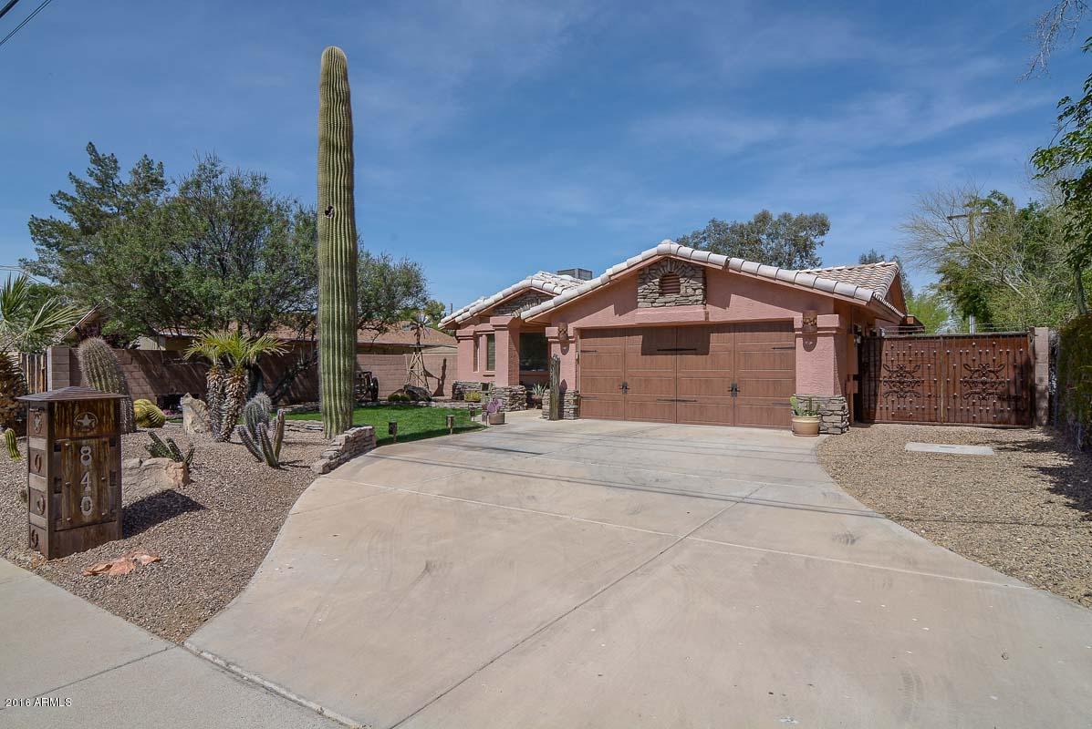 840 East Roberts Road Phoenix, AZ 85022 - Photo 9 of 52 a front view of a house with a garden