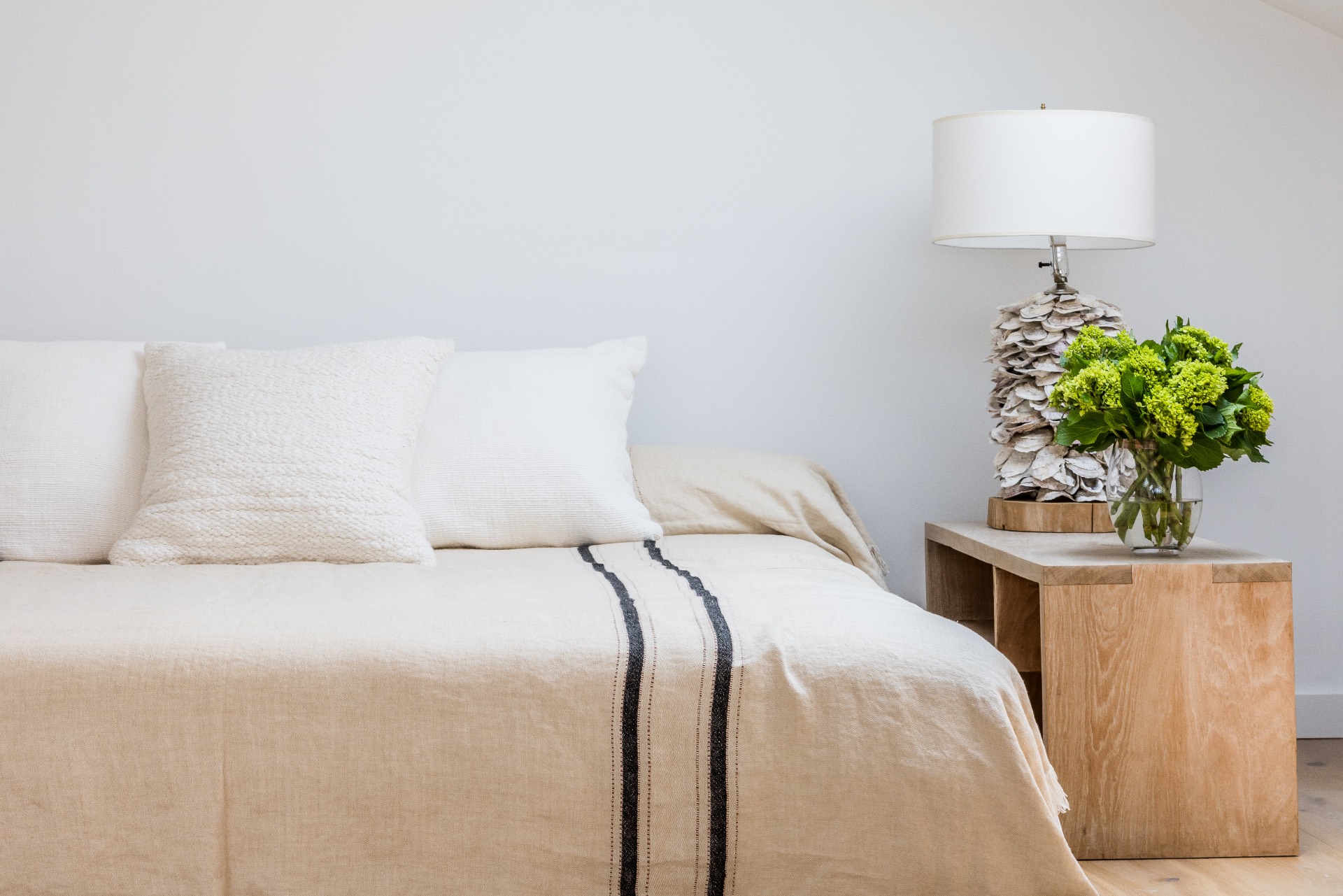 35 Hampton Road Sag Harbor, NY 11963 - Photo 17 of 27 a bedroom with a bed and a lamp